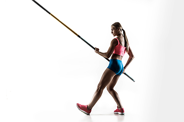 Image showing Female pole vaulter training on white studio background