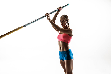 Image showing Female pole vaulter training on white studio background