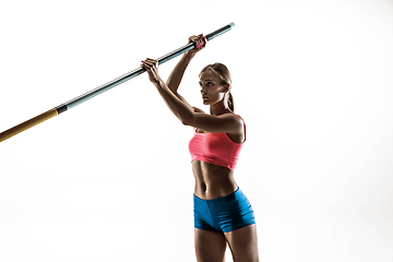 Image showing Female pole vaulter training on white studio background