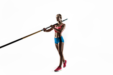 Image showing Female pole vaulter training on white studio background