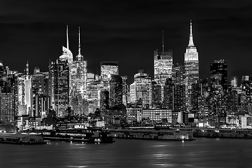 Image showing West New York City midtown Manhattan skyline view from Boulevard East Old Glory Park over Hudson River at dusk.