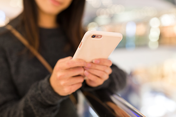 Image showing Woman use of mobile phone in shopping mall