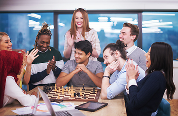 Image showing multiethnic group of business people playing chess