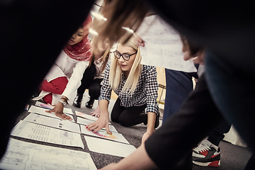 Image showing blonde businesswoman having meeting with Multiethnic  startup bu