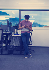 Image showing software developer using mobile phone