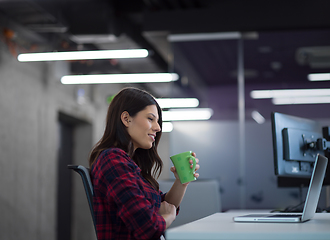 Image showing female software developer using laptop computer