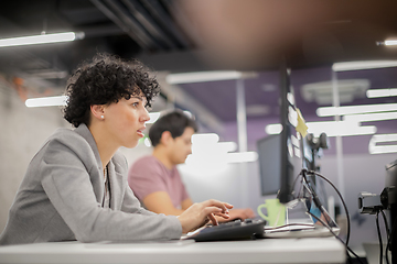 Image showing female software developer using desktop computer