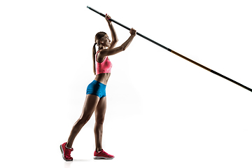 Image showing Female pole vaulter training on white studio background