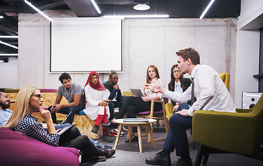 Image showing Multiethnic startup business team having meeting