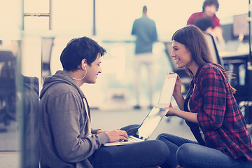 Image showing software developers couple working on the floor