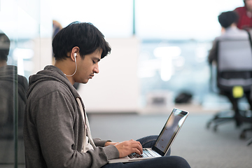 Image showing software developer working on the floor