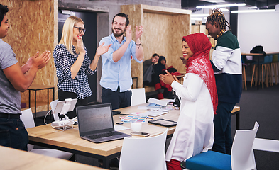 Image showing multiethnic Group of young business people celebrating success