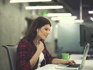 Image showing female software developer using laptop computer