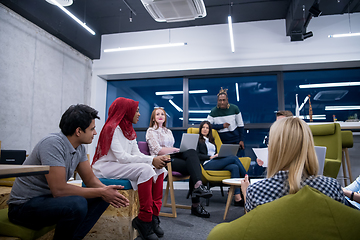 Image showing Multiethnic startup business team having meeting