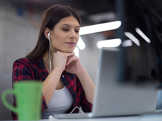 Image showing female software developer using laptop computer