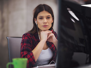 Image showing female software developer using laptop computer