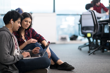 Image showing software developers couple working on the floor