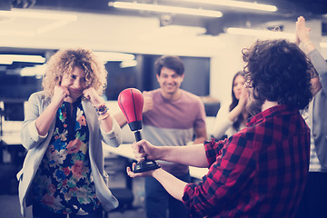 Image showing multiethnics business team boxing at office