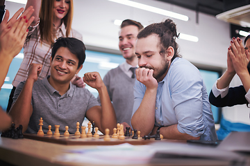 Image showing multiethnic group of business people playing chess