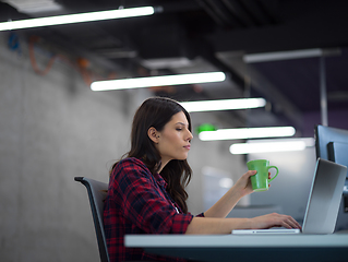 Image showing female software developer using laptop computer