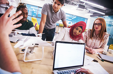 Image showing multiethnic business team learning about drone technology