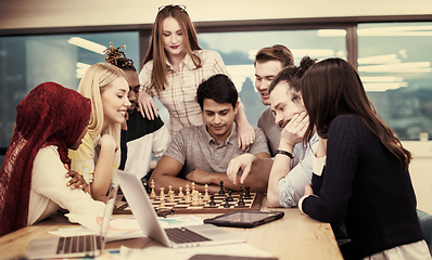 Image showing multiethnic group of business people playing chess