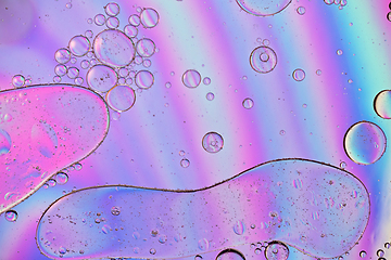 Image showing Holographic colorful abstract background with oil drops on water