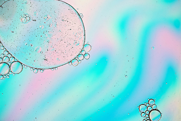 Image showing Holographic colorful abstract background with oil drops on water