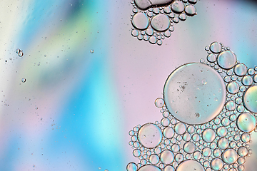 Image showing Holographic colorful abstract background with oil drops on water
