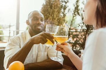 Image showing Young group of friends drinking beer and celebrating together