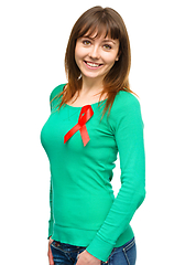 Image showing Woman with the red awareness ribbon