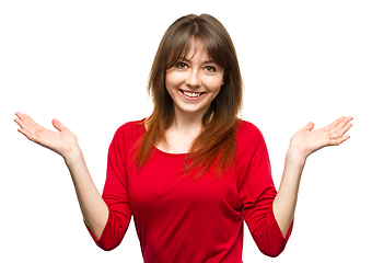 Image showing Portrait of a young woman raised her hands up