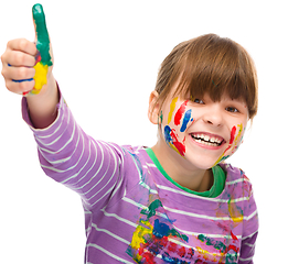 Image showing Portrait of a cute girl playing with paints