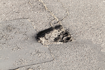 Image showing Closeup broken road