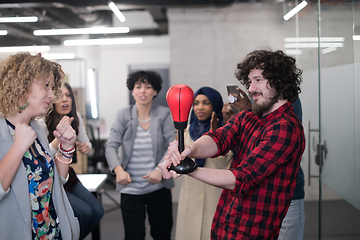 Image showing multiethnics business team boxing at office