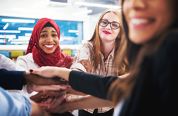 Image showing multiethnic Group of young business people celebrating success