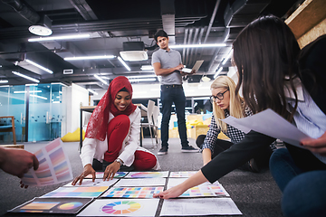 Image showing black muslim woman having meeting with Multiethnic  startup busi