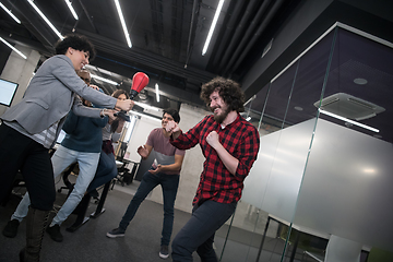 Image showing multiethnics business team boxing at office