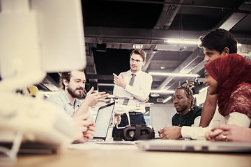 Image showing multiethnic business team learning about drone technology