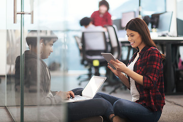 Image showing software developers couple working on the floor