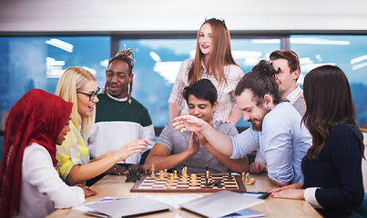 Image showing multiethnic group of business people playing chess