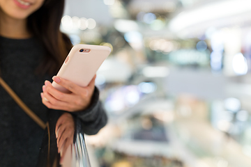 Image showing Woman sending sms on mobile phone