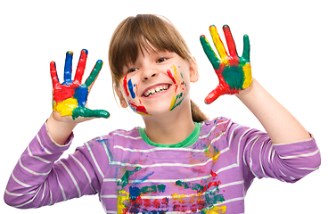 Image showing Portrait of a cute girl playing with paints