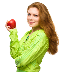 Image showing Young happy girl with apple