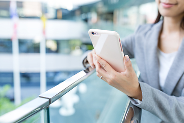 Image showing Businesswoman working on cellphone