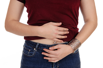 Image showing Closeup of a woman's stomach with pain