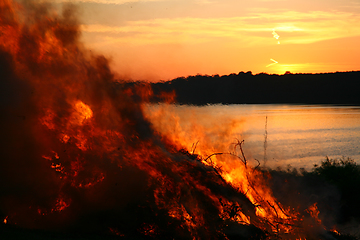 Image showing Outdoor fire nearby a lake in the summer in Denmark