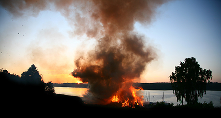 Image showing Outdoor fire nearby a lake in the summer in Denmark