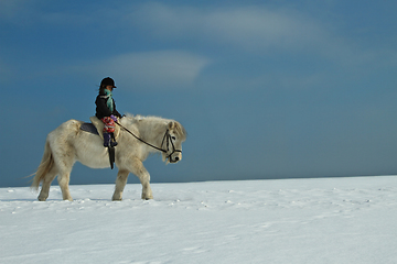 Image showing Girl Horse riding in the snow