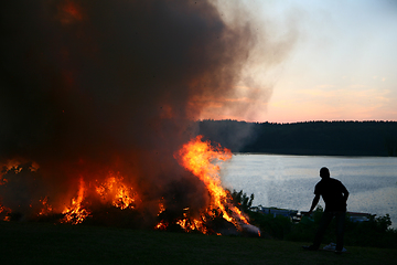 Image showing Outdoor fire nearby a lake in the summer in Denmark